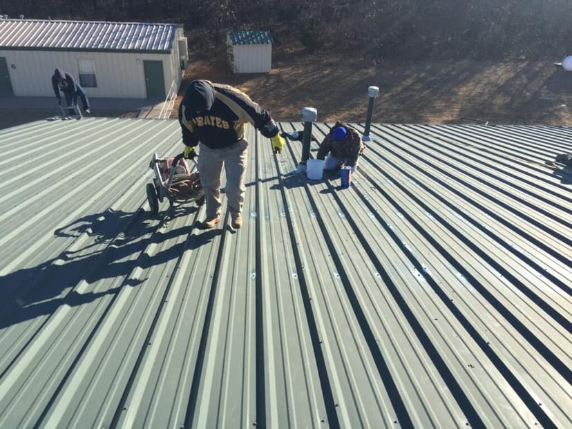 Absolute crew installing a metal roof